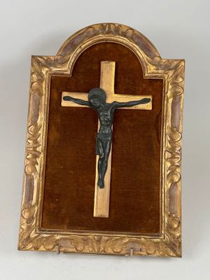 an image of a crucifix in a gold frame on a white background