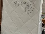 two mattresses that are sitting in a room