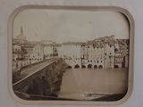 an old photo of a bridge over a river