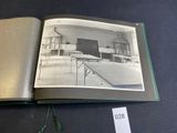 an open book with a picture of a room in it