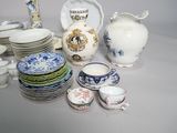 many different types of china dishes and cups on the table