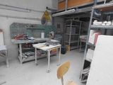 an image of a workshop with a chair and shelves