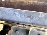 a close up of a metal object with writing on it