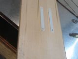 a piece of wood sitting on top of a metal table