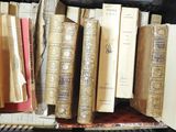 many books that are on a shelf in the room