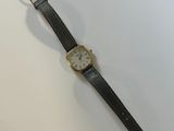 an image of a wrist watch on a white surface