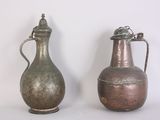 two vases sitting next to each other on a table