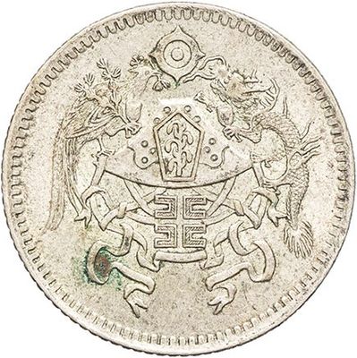 a silver coin with an image of a man on a horse