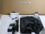 a box with a black bag and a charger inside of it