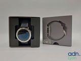 an image of a box with a watch inside of it on a white surface