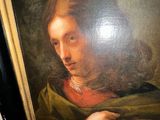 portrait of a man in a green coat holding a green shawl