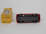 a small toy car sitting next to a box on a table