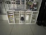 a room with a lot of items on the shelves