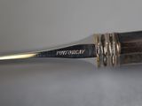 a close up of a pen with a metal tip