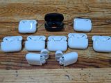 a lot of airpods that are sitting on a table
