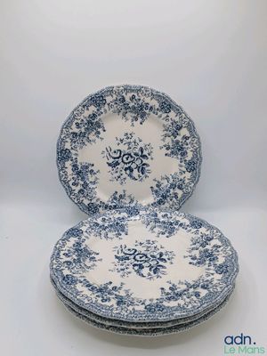 three blue and white plates are stacked on top of each other