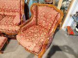 two chairs that are sitting next to each other in a room