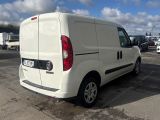 a white van that is parked in a parking lot