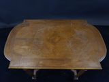 an image of a wooden table with a wooden top on a black background