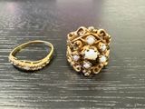 a gold ring and a gold ring on a table