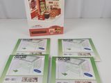three sets of brochures are sitting on a table in front of a box