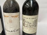 three bottles of wine sitting next to each other on a table