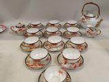 a lot of cups and saucers on the table
