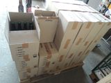 boxes of beer are stacked on top of a pallet in a warehouse