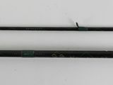 a close up of two fishing rods on a white surface