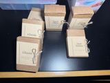 six boxes of soap sitting on top of a table next to a box of soap