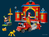 a toy fire truck with mickey mouse and mickey mouse on it