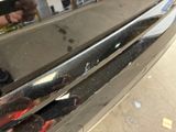 a close up of a car ' s front bumper with scratches on it