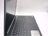 a laptop computer sitting on top of a white table