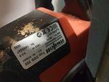 someone is using a chainsaw to cut a piece of wood