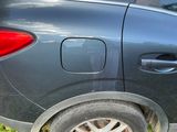 a car that has a flat tire on the side of the road