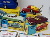many toy cars that are sitting on top of each other