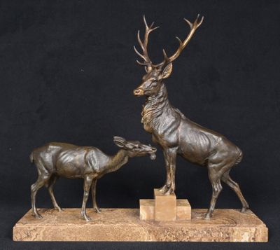bronze sculpture of a stag and a baby deer on a marble base