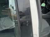 a woman taking a picture of herself in a car