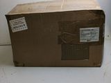 a box that is sitting on the floor next to a wall