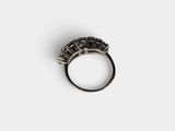 a close up of a ring on a white surface