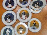 six plates with pictures of people on them on a table
