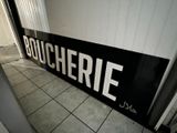 a black and white sign that says boucherrie on it