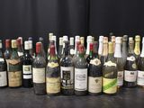 a lot of bottles of wine on the table