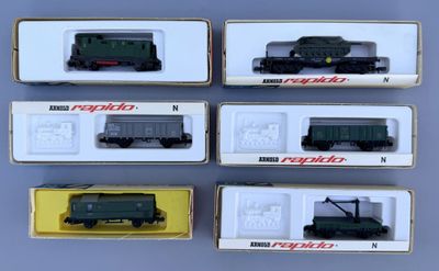 six different model trains are in a box on a table