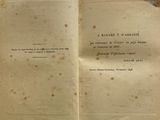 someone is holding a book open to a page with writing on it