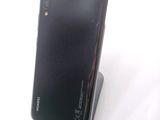 the back of a black phone with a stand on top of it
