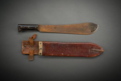 pair of two knives with wooden handles on a gray surface