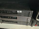 a lot of electronics that are sitting on a shelf