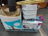 a box of toilet paper and a cup of coffee on the floor