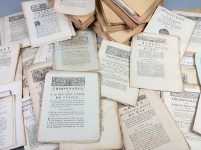 a pile of old books sitting on top of a table